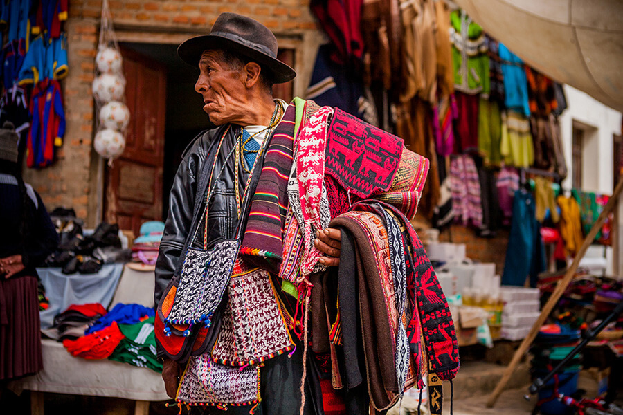 Man selling traditional waving in Tarabuco